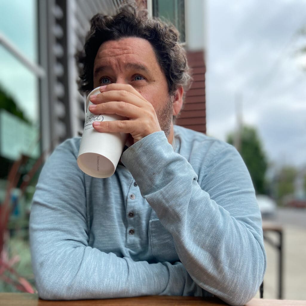 Joshua Moon, an online course and instructional design expert, drinking coffee in Portland, Oregon
